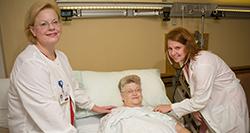 Patient in bed with doctor